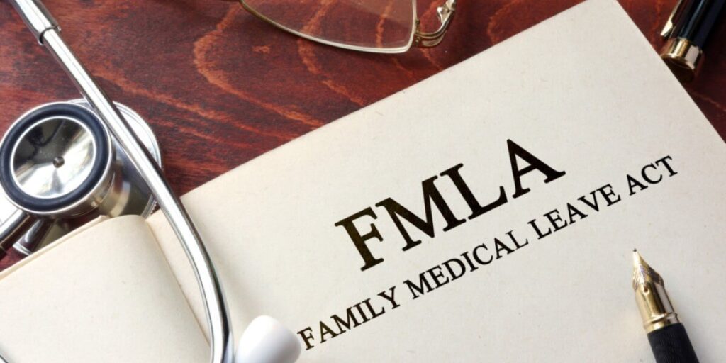 Medical personnel reviewing documents to uncover FMLA fraud in a workplace setting.